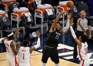 Karl-Anthony Towns #32 of the Minnesota Timberwolves passes the ball